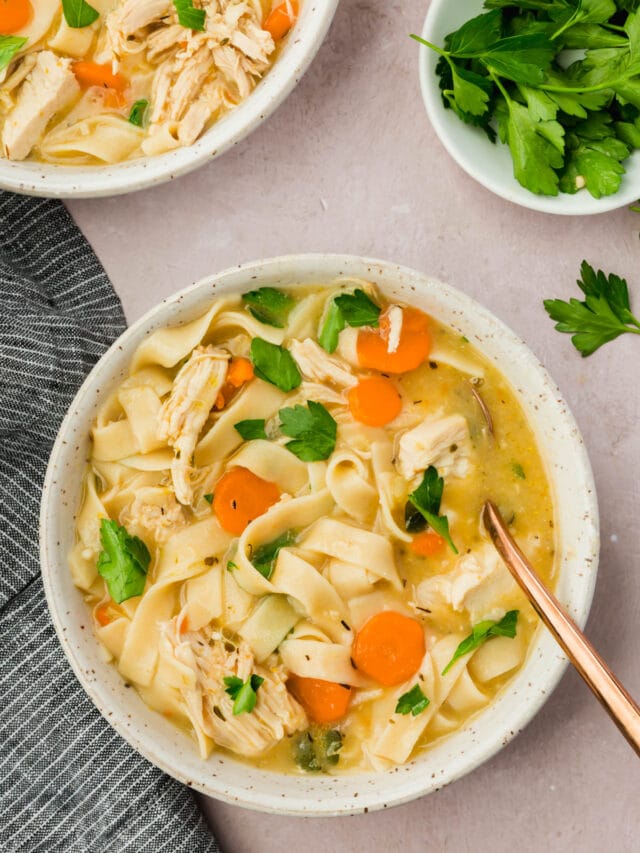 A bowl of gluten-free chicken noodle soup.