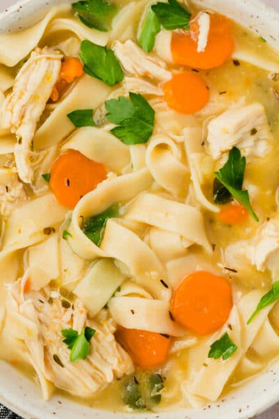 A bowl of gluten-free chicken noodle soup.