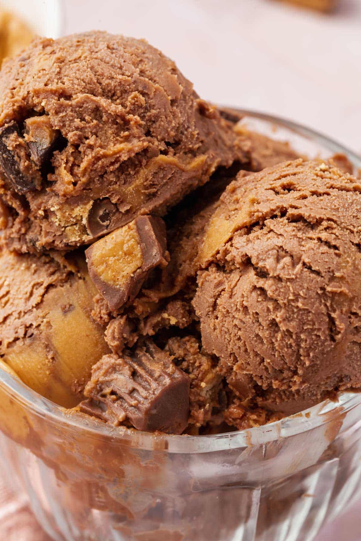 A close up of scoops of chocolate peanut butter cup ice cream.