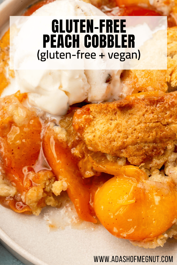 A closeup of gluten-free vegan peach cobbler topped with a scoop of ice cream.
