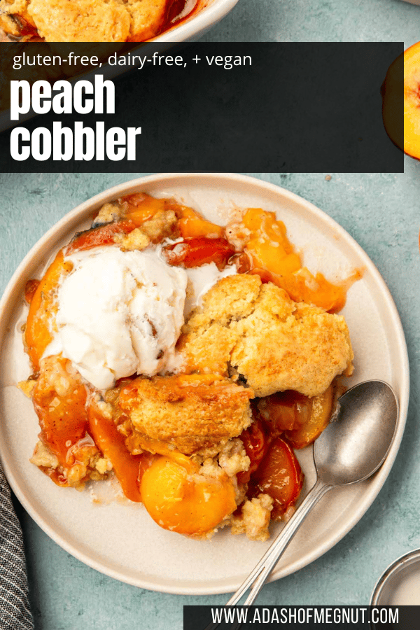 A plate with a serving of gluten-free vegan peach cobbler topped with a scoop of ice cream.