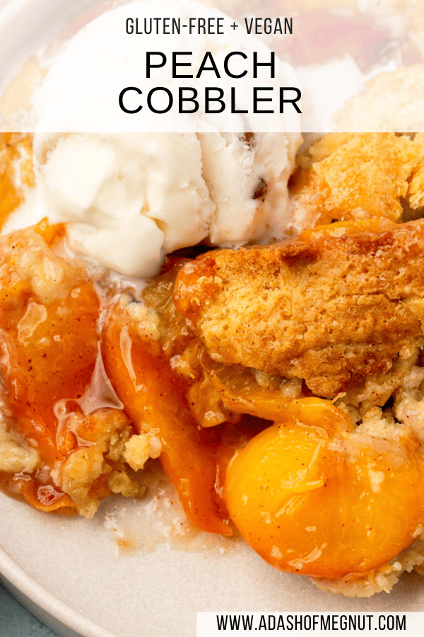 A closeup of a serving of gluten-free peach cobbler topped with a scoop of ice cream.