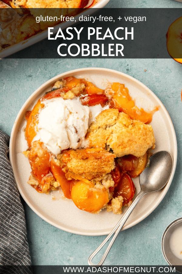 A plate with a serving of gluten-free peach cobbler topped with a scoop of ice cream and a spoon.