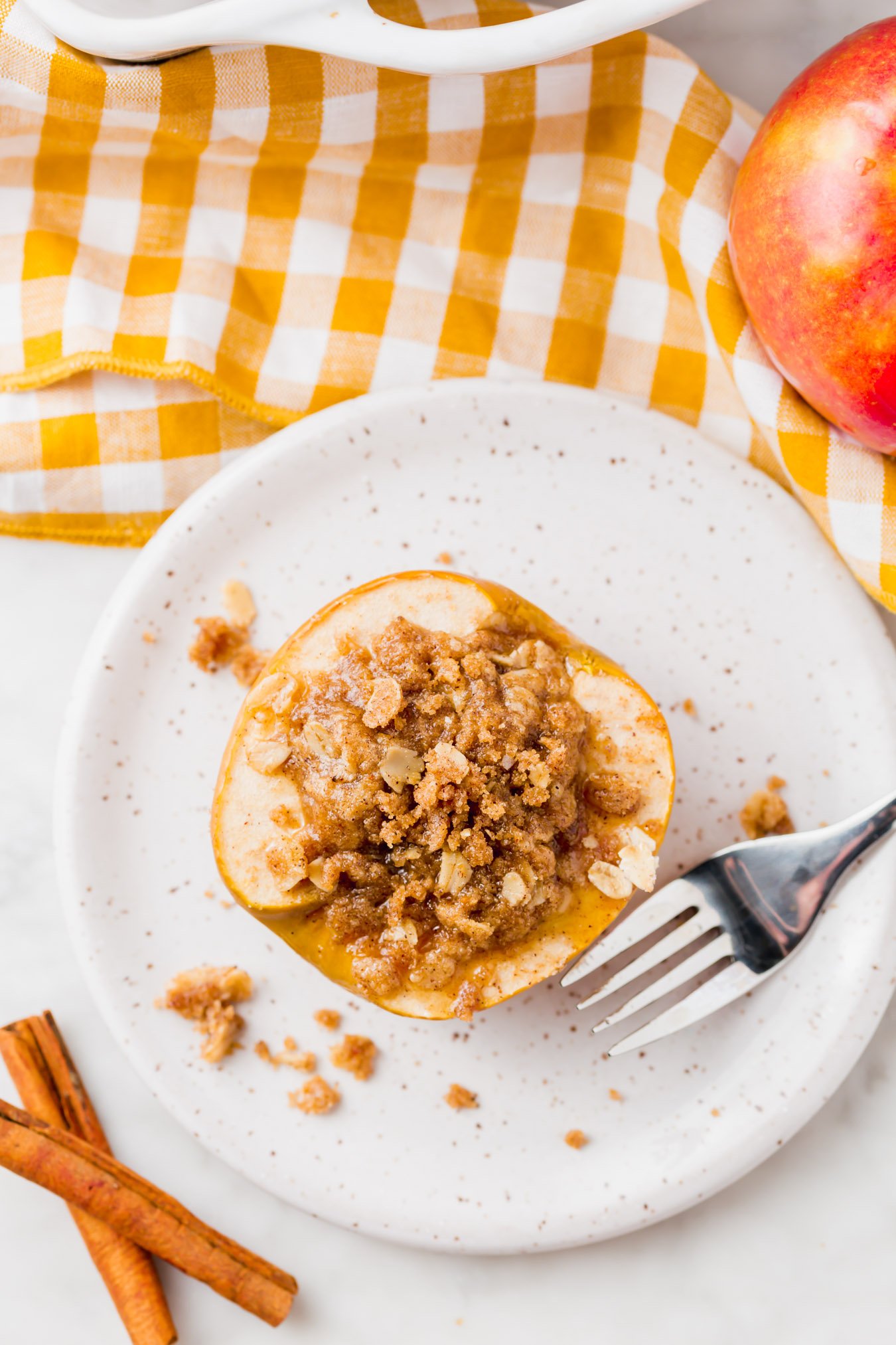 An overhead photo of baked apple with gluten-free streusel. 