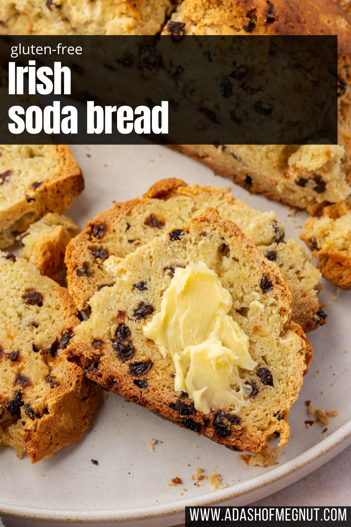 A plate of slices Irish soda bread with currants, with one topped with a slather of Irish butter.