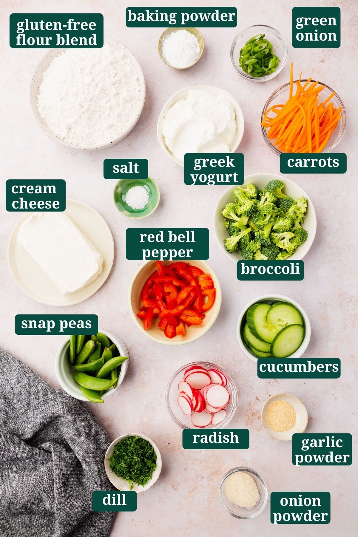 Ingredients for making gluten-free cold veggie pizza in bowls on a stone surface with text overlays.