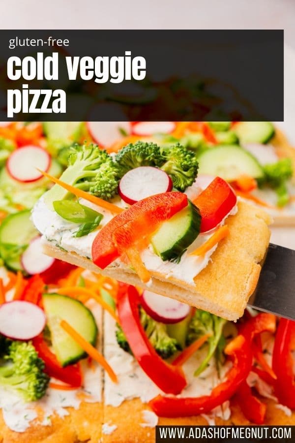 A spatula removing a slice of cold veggie pizza from the full pizza with a text overlay.