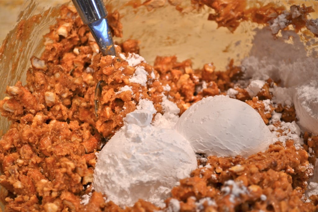 Peanut butter, pretzels and powdered sugar in a large mixing bowl. 