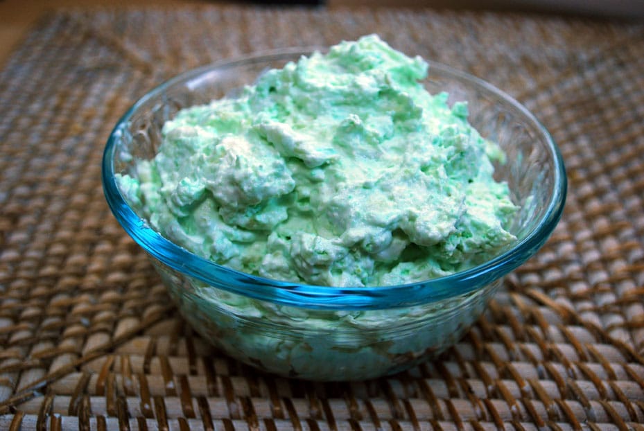 A glass bowl of watergate salad.
