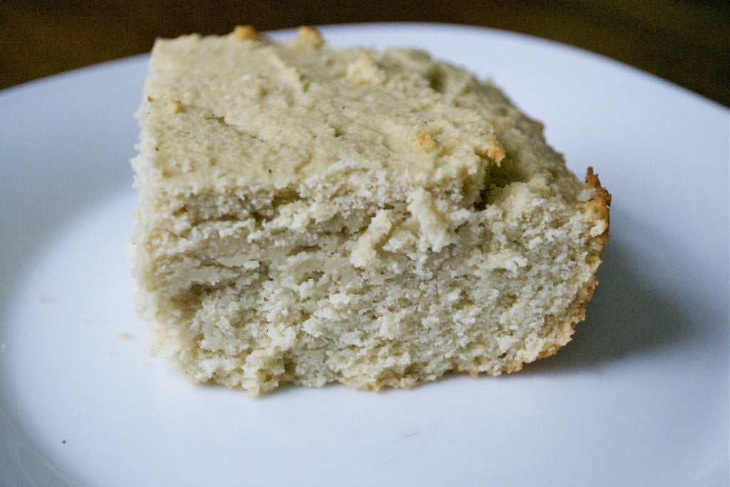 A slice of masa harina cornbread on a white plate.