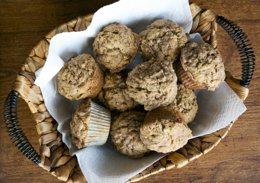 A basket of gluten-free cinnamon streusel muffins. 