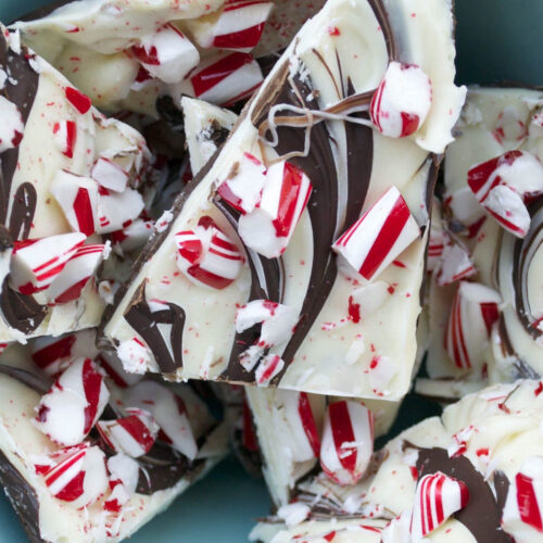 Close-up of chocolate peppermint bark showing distinct dark chocolate and white chocolate layers with crushed peppermint candy