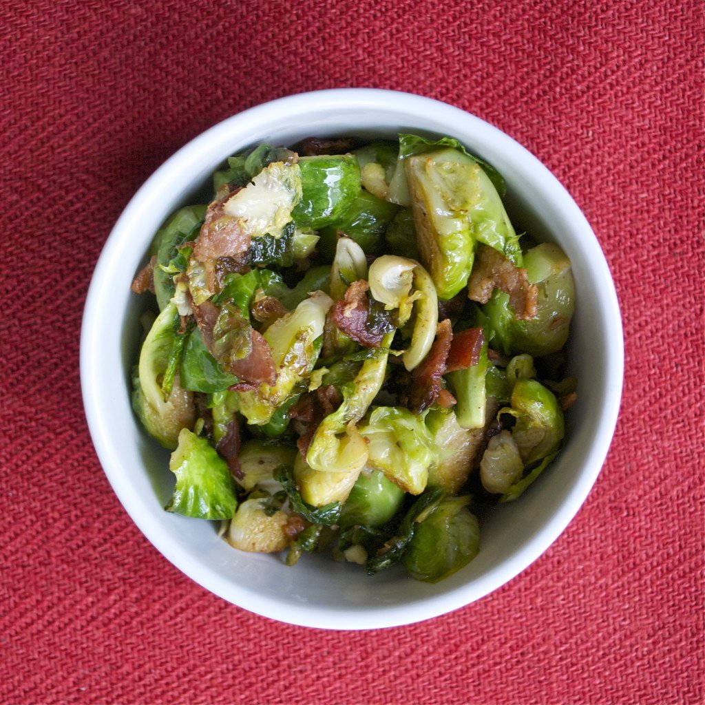 A bowl of sautéed brussels sprouts and bacon. 