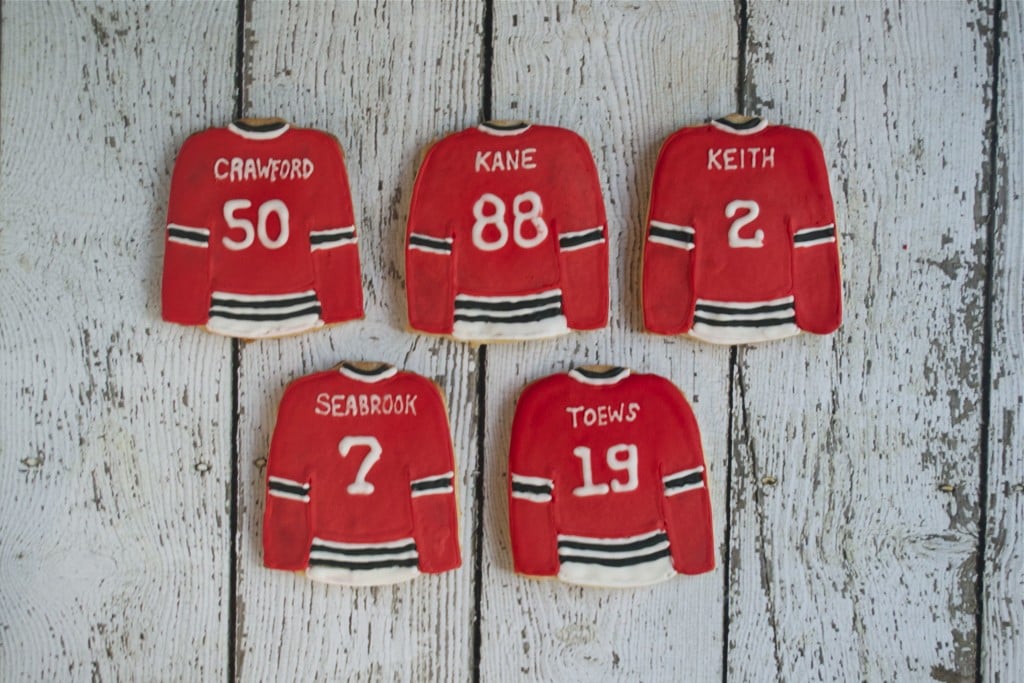 Sugar cookies decorated with royal icing to look like Chicago Blackhawks jerseys.