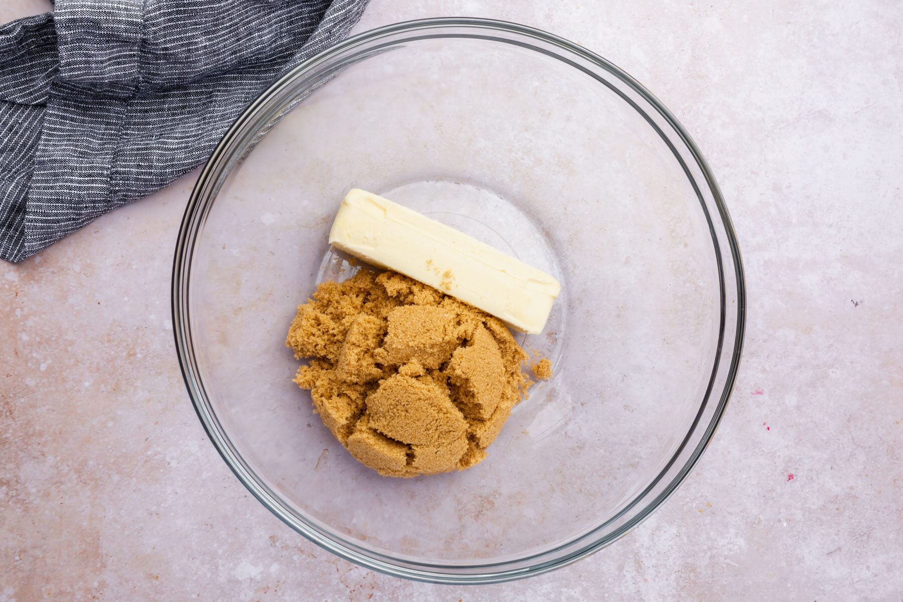 Softened butter and brown sugar in a bowl.
