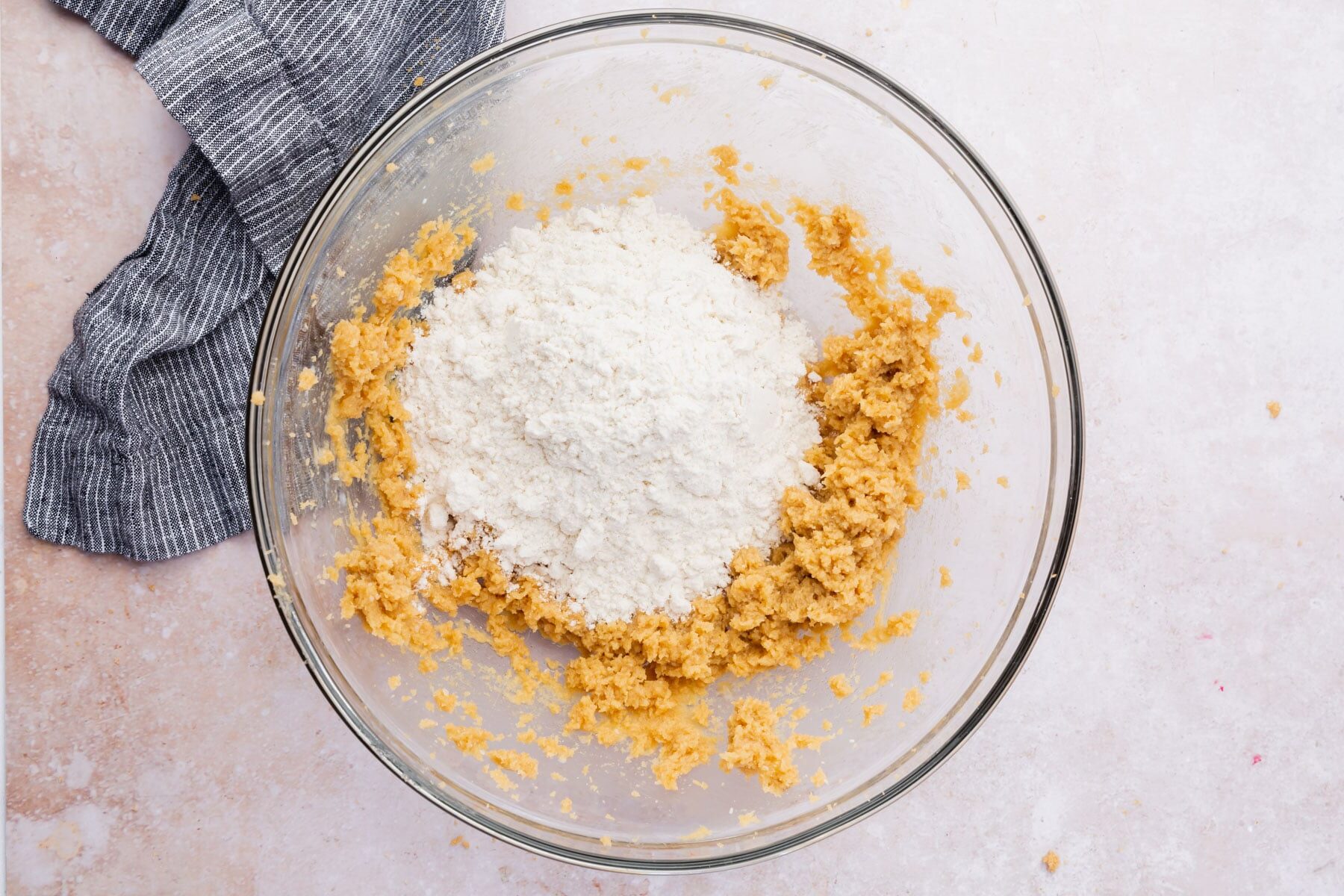 Heat-treated flour being added to cookie dough.