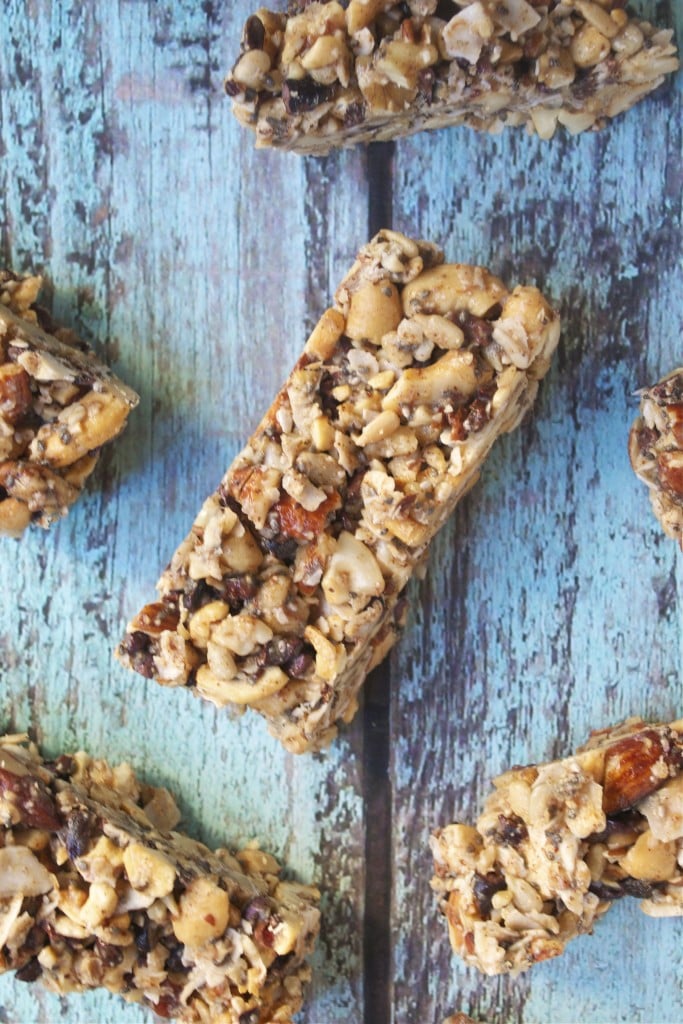 Grain-free granola bars spaced out on a blue table.