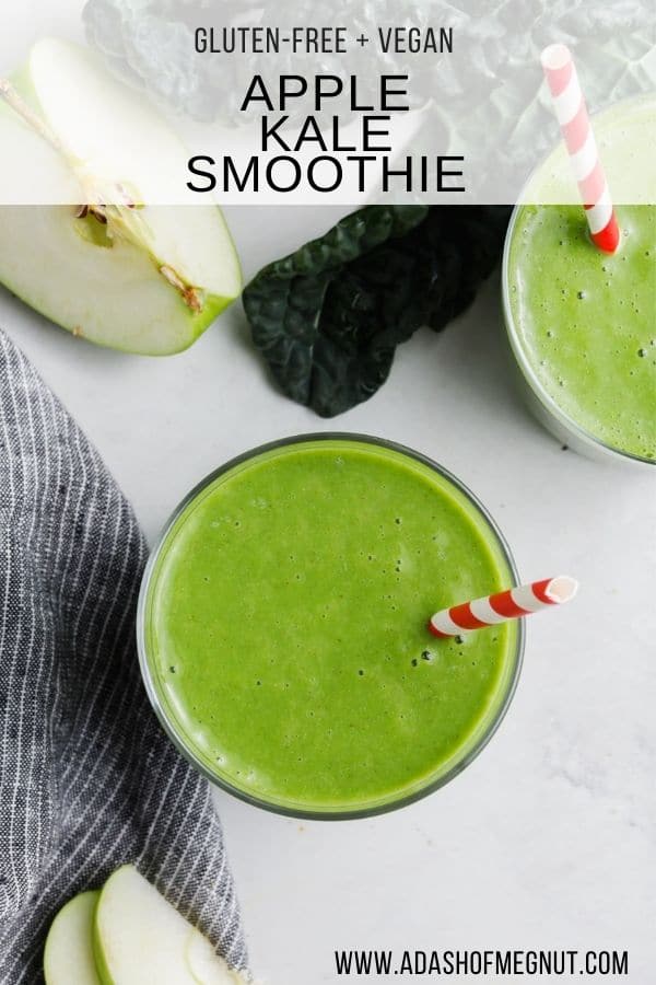 An overhead view of a glass of apple kale smoothie with a red striped straw