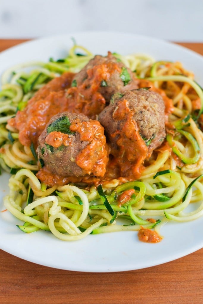 Zoodles with Turkey Meatballs in a Roasted Red Pepper Sauce on a plate.