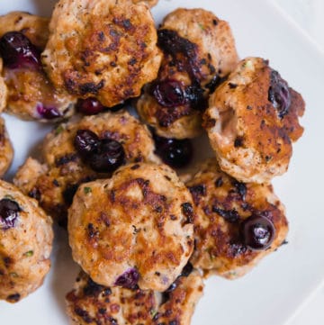 A photo of a platter with blueberry turkey breakfast sausages on it.