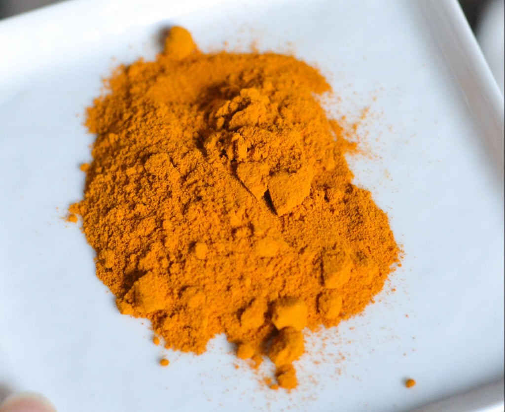 A plate full of ground turmeric. 