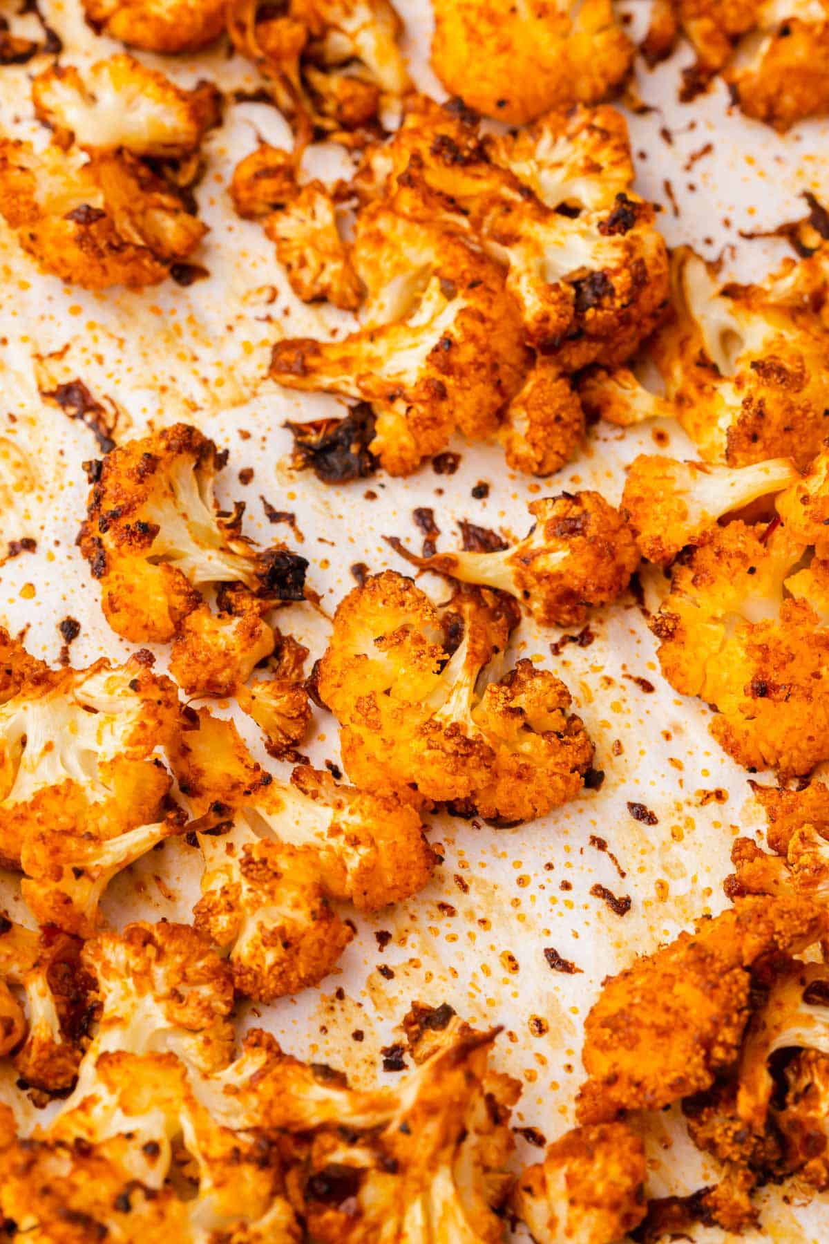 A close up of roasted cauliflower that has been seasoned with taco seasoning, adobo sauce, and chipotle peppers in adobo sauce.