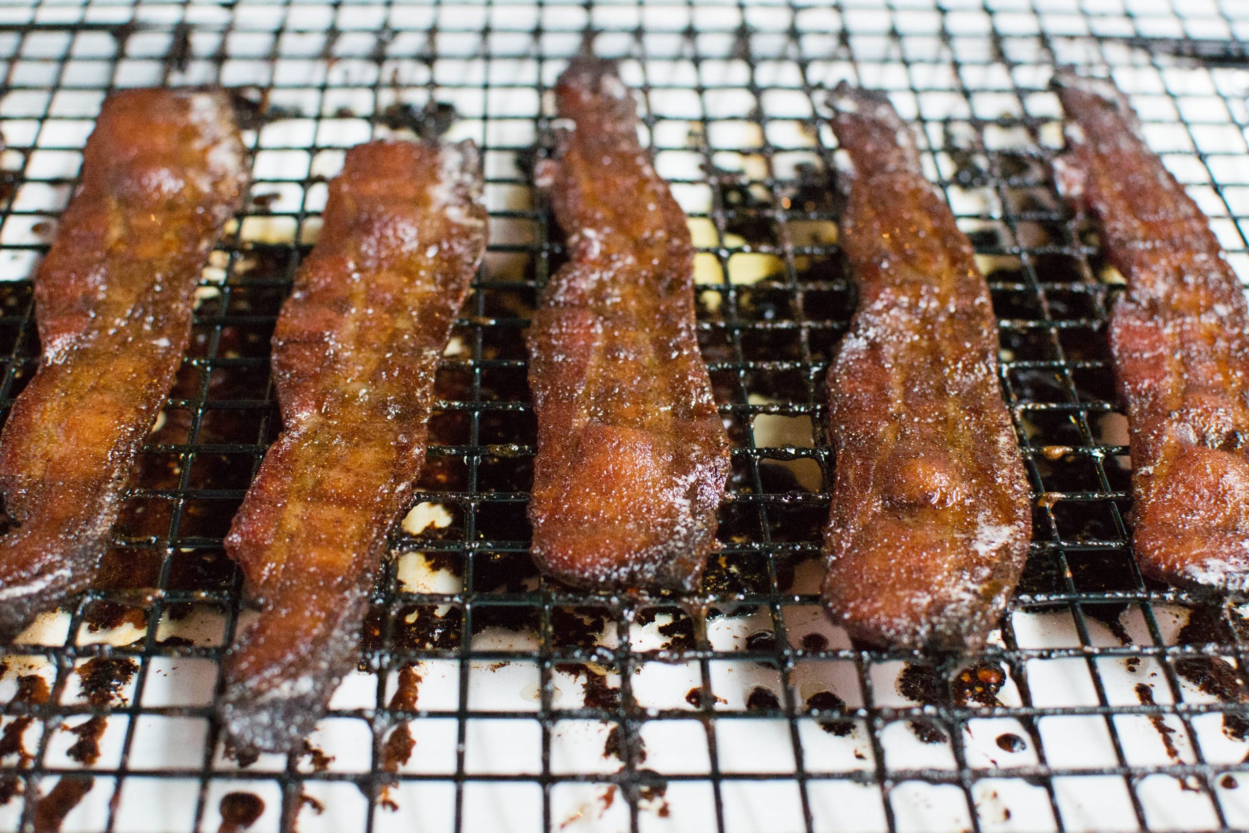 Gingerbread candied bacon, molasses, ginger, cloves, cinnamon, brown sugar, all baked in the oven to perfection. Gluten-free too!