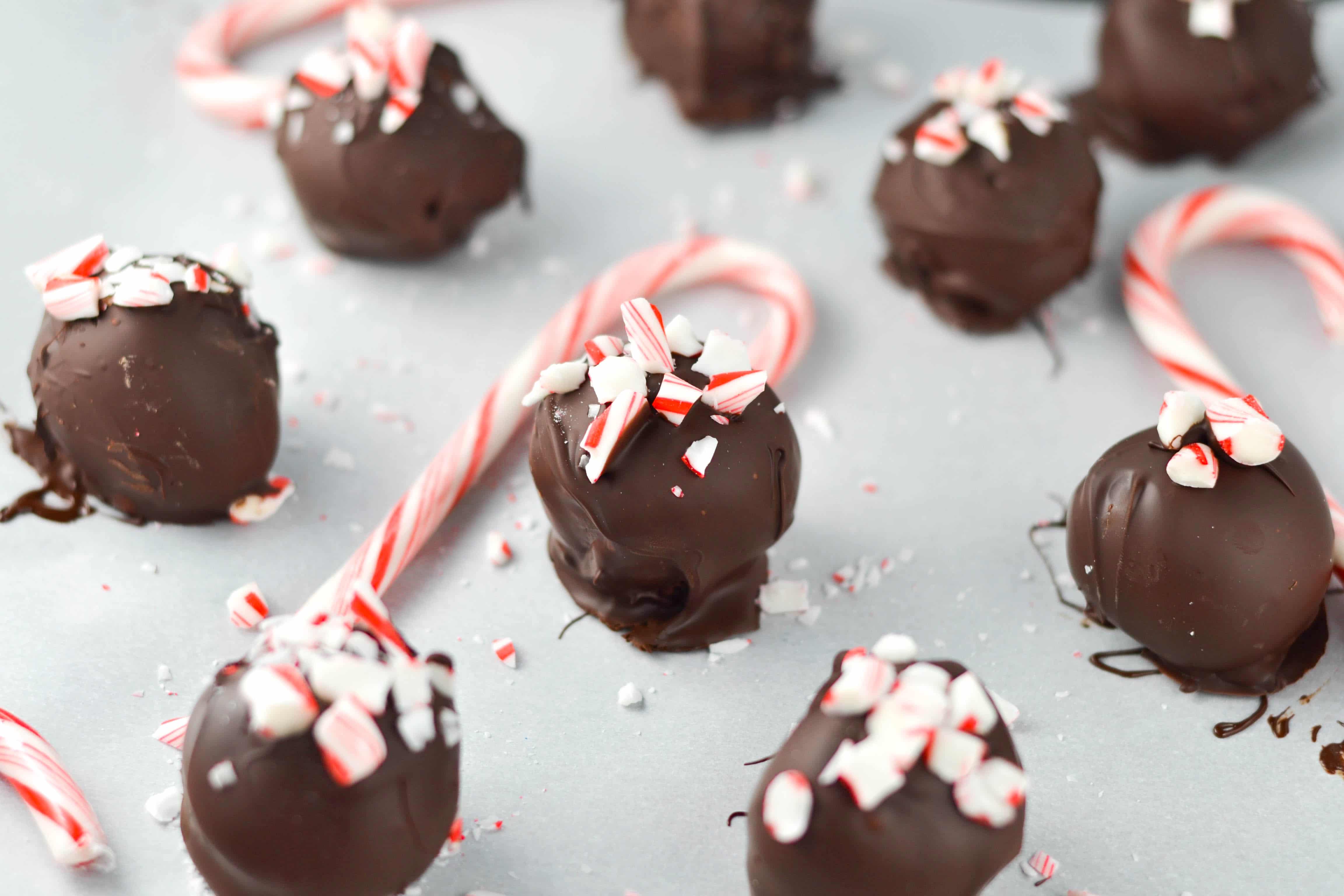 Vegan peppermint truffles on a baking sheet lined with parchment paper. 