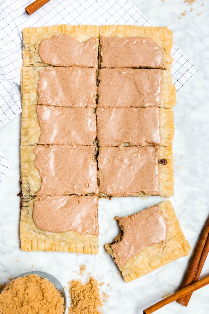 A giant brown sugar cinnamon pop tart sliced into ten pieces.