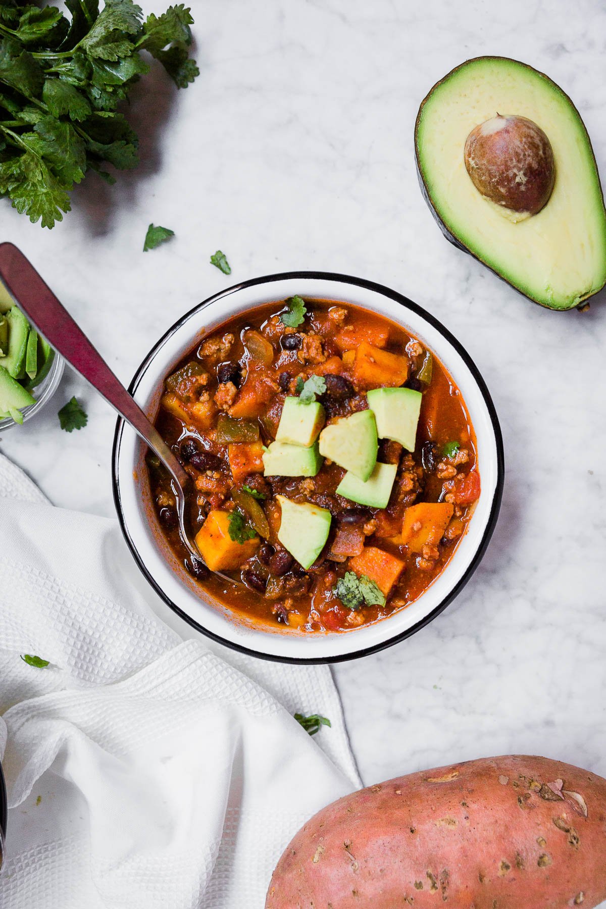 Sweet potato turkey chili with avocado and cilantro. 