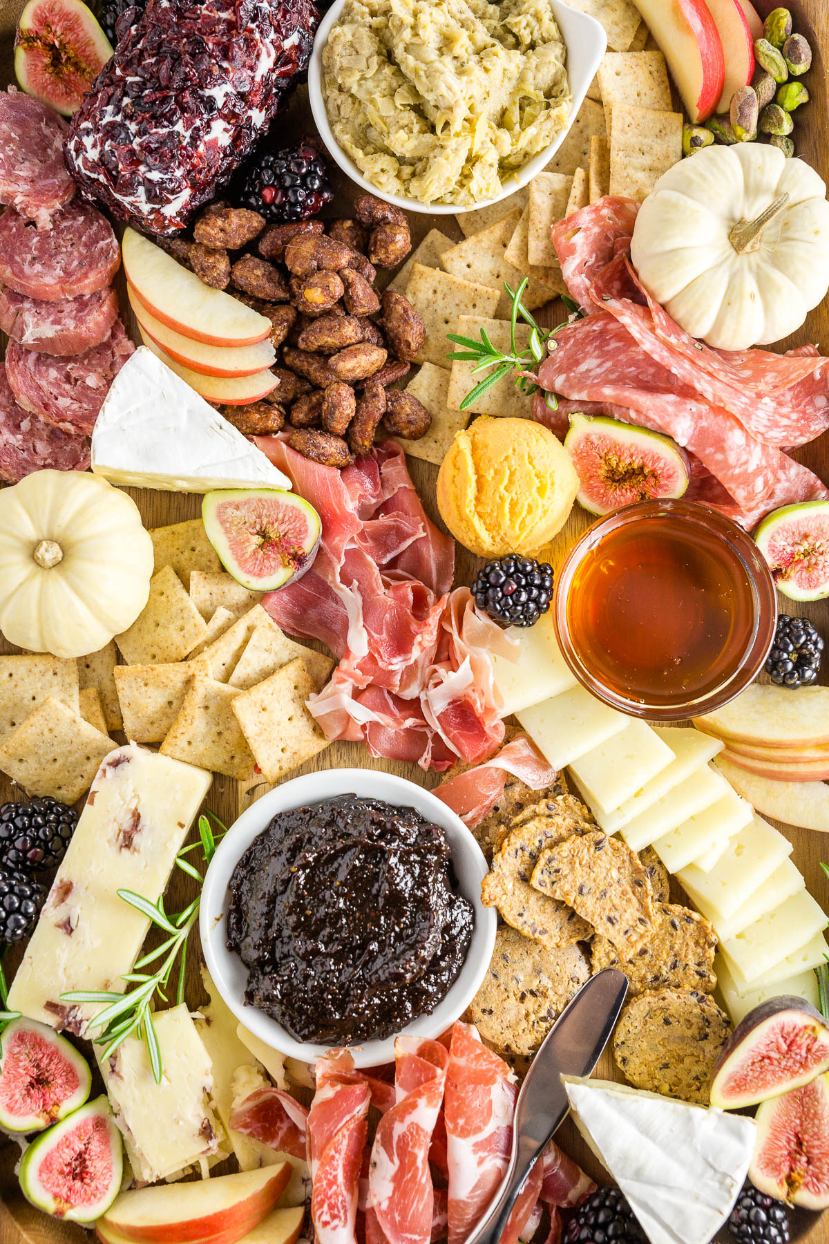 Gluten-free charcuterie and cheese board with crackers, cheeses, and cured meats. 