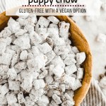 Dairy-free puppy chow in a wooden bowl with a spoonful of peanut butter and chocolate chips and powdered sugar on a linen napkin and table.