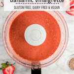A photo of a food processor with strawberry balsamic vinaigrette after blending.