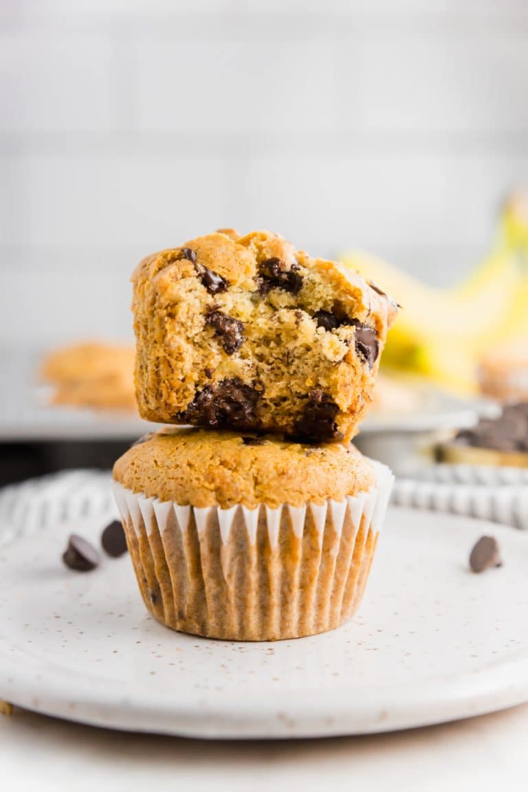 Two gluten-free vegan banana chocolate chips banana muffins stacked on top of each other.