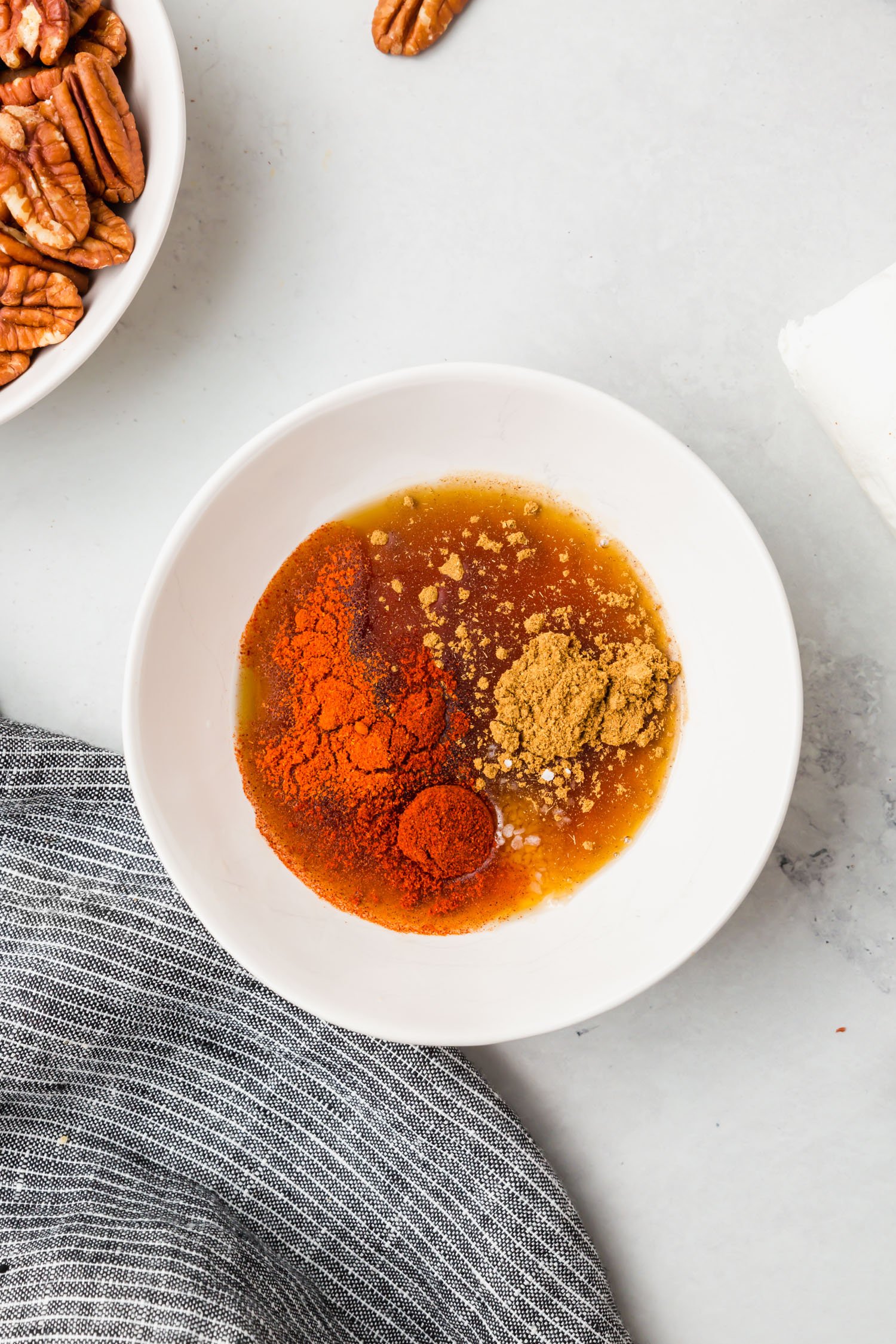 A bowl of maple syrup and spices.