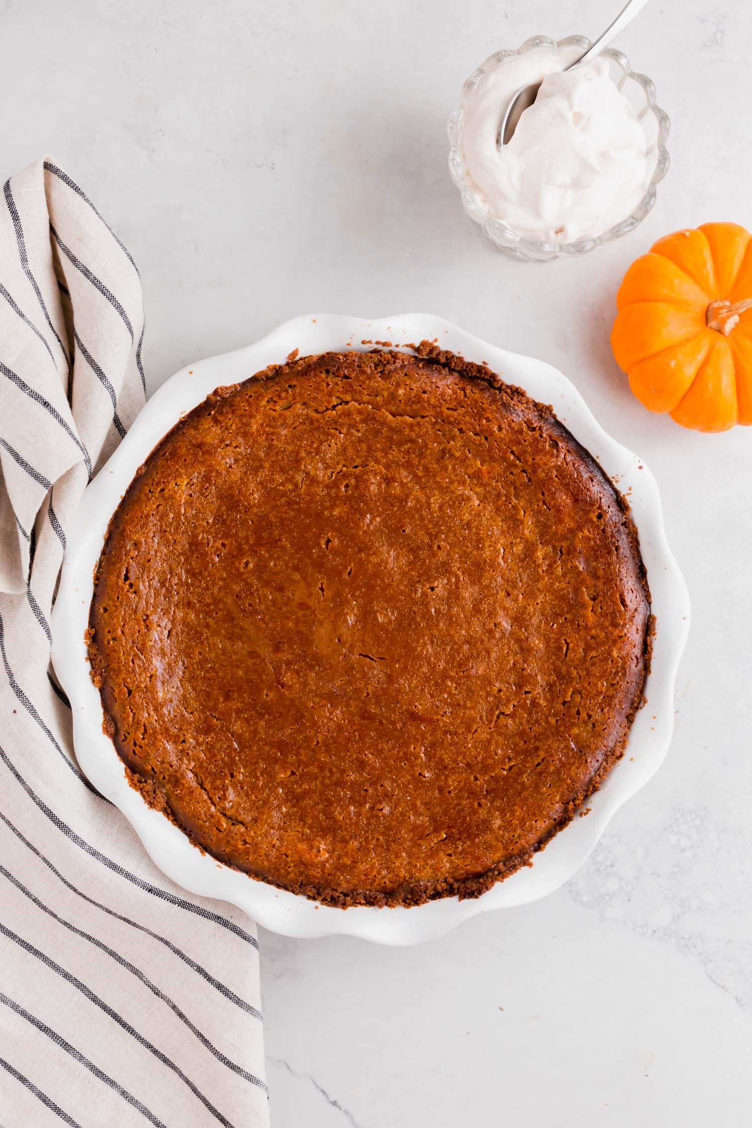 A gluten-free pumpkin pie with graham cracker crust after baking.