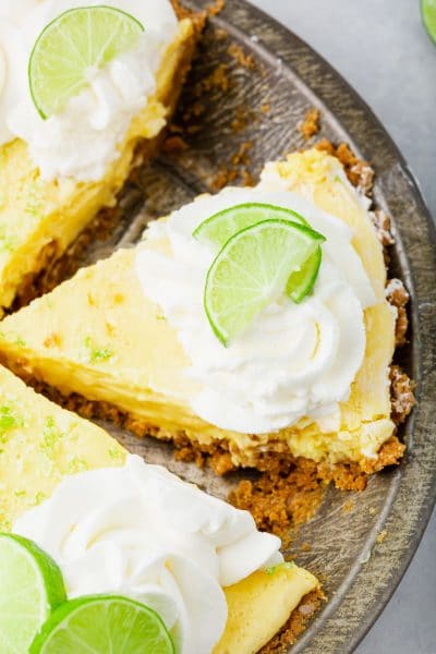 A photo of slices of key lime pie in a pie tin.