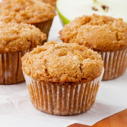 Four gluten-free vegan apple cinnamon muffins.
