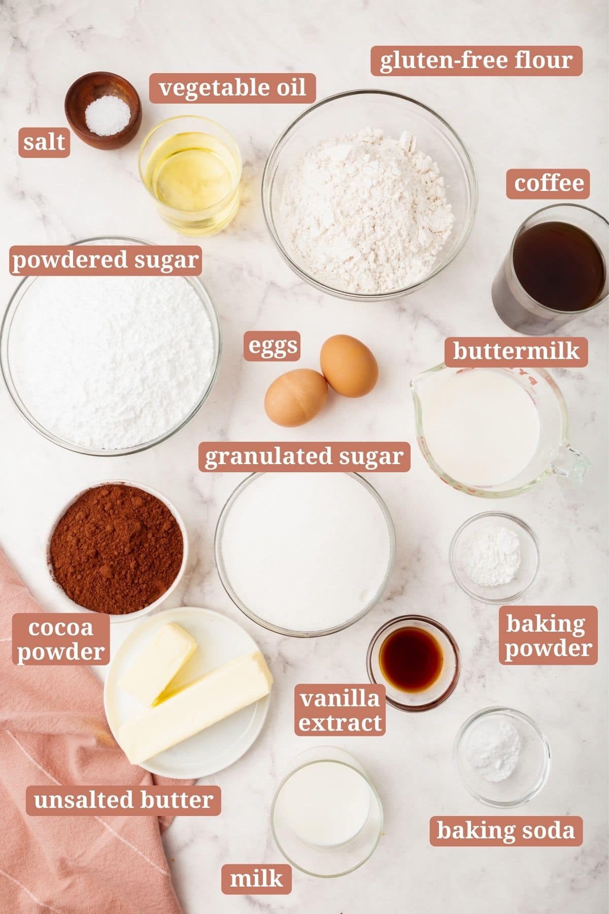 Ingredients for making a gluten-free chocolate cake with chocolate frosting.