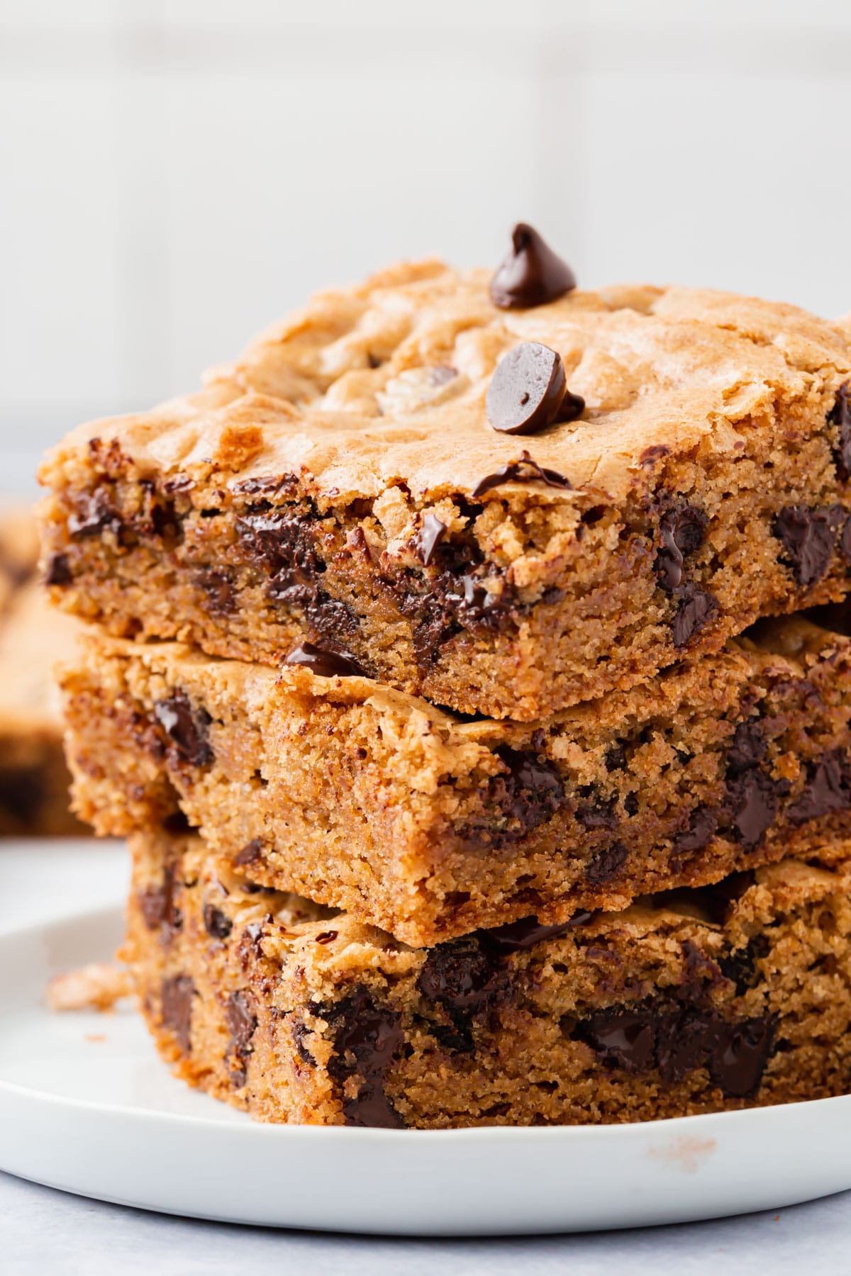 A stack of gluten-free chocolate chip cookie bars.