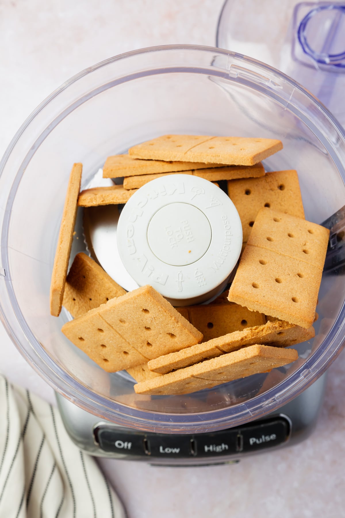 Gluten-free graham crackers in a food processor before processing.