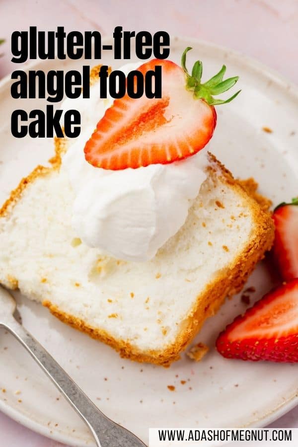 A slice of angel food cake on a plate with a fork topped with a dollop of whipped cream and half of a strawberry with a text overlay.