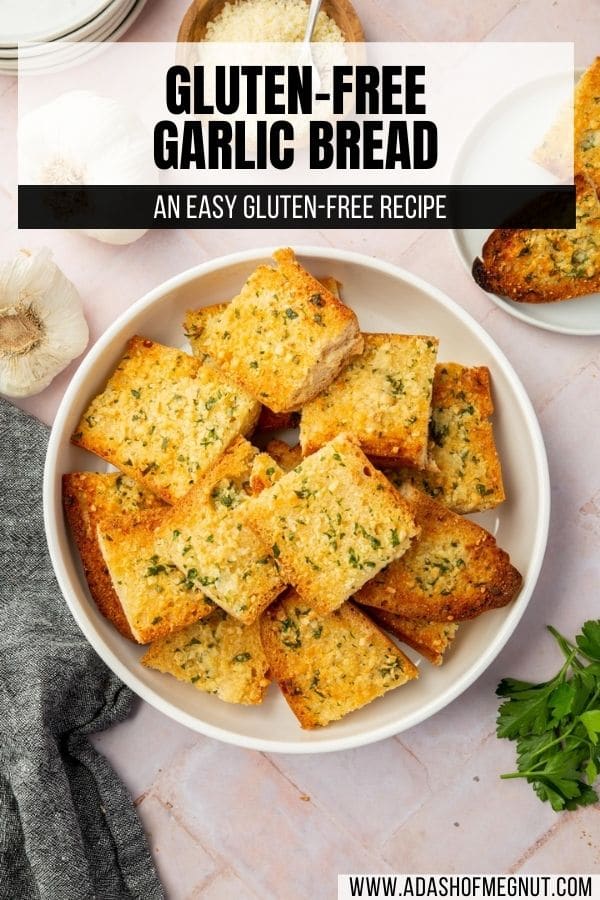 An overhead shot of a bowl of gluten-free garlic bread pieces with a text overlay.