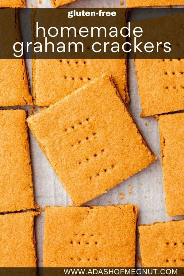 Graham crackers slightly overlapping one another on a piece of parchment paper.