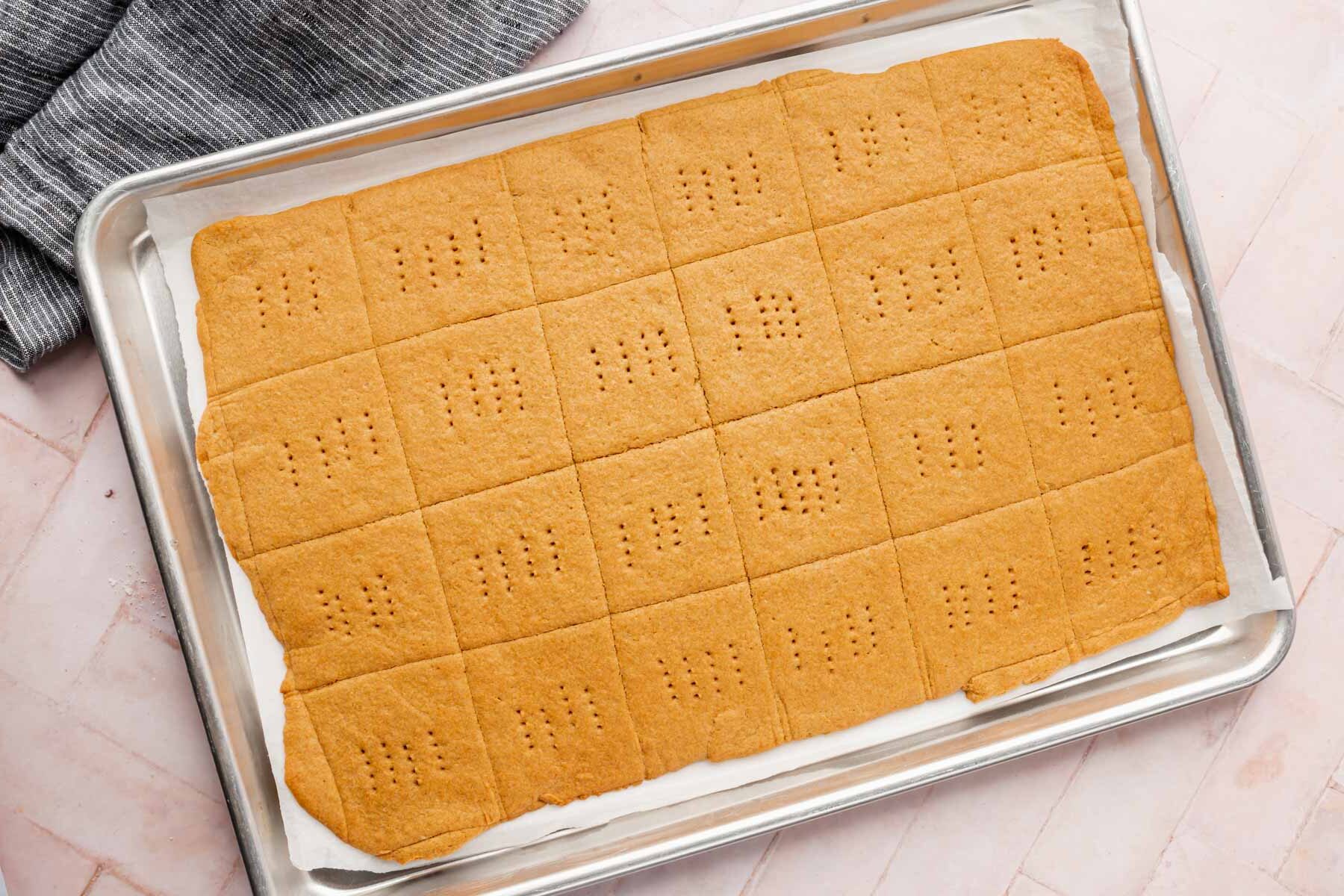 Baked graham crackers on a baking sheet.