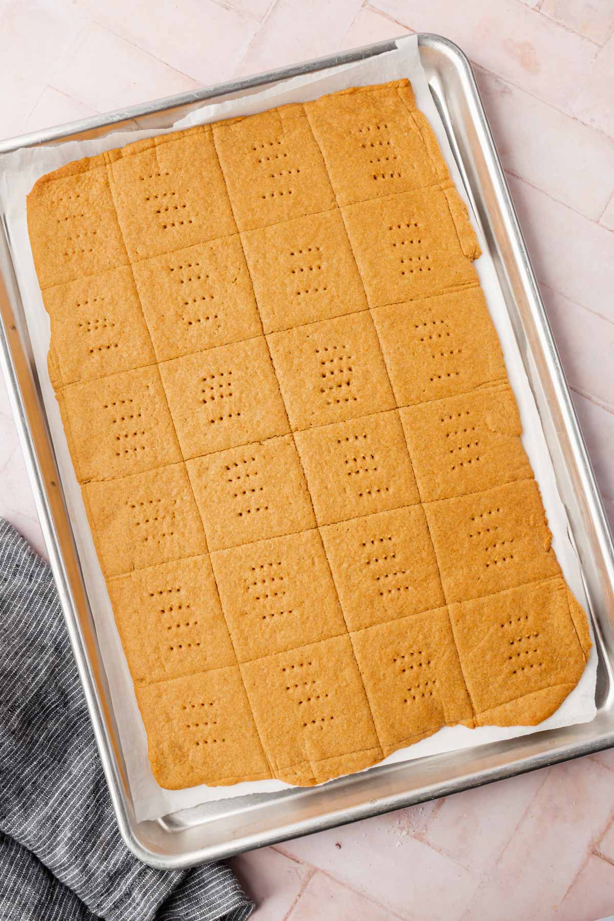 Baked graham crackers on a baking sheet.