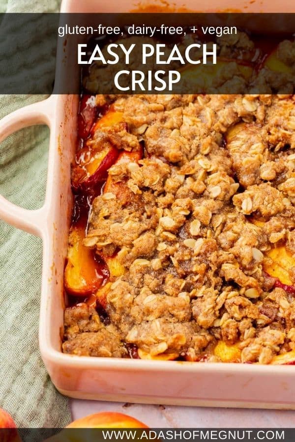 Baked gluten-free vegan peach crisp in a pink square baking dish with a text overlay.