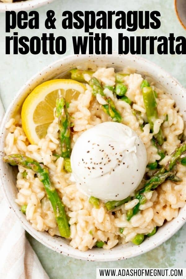 A bowl of pea and asparagus risotto topped with lemon wedge and a ball of burrata sprinkled with black pepper.