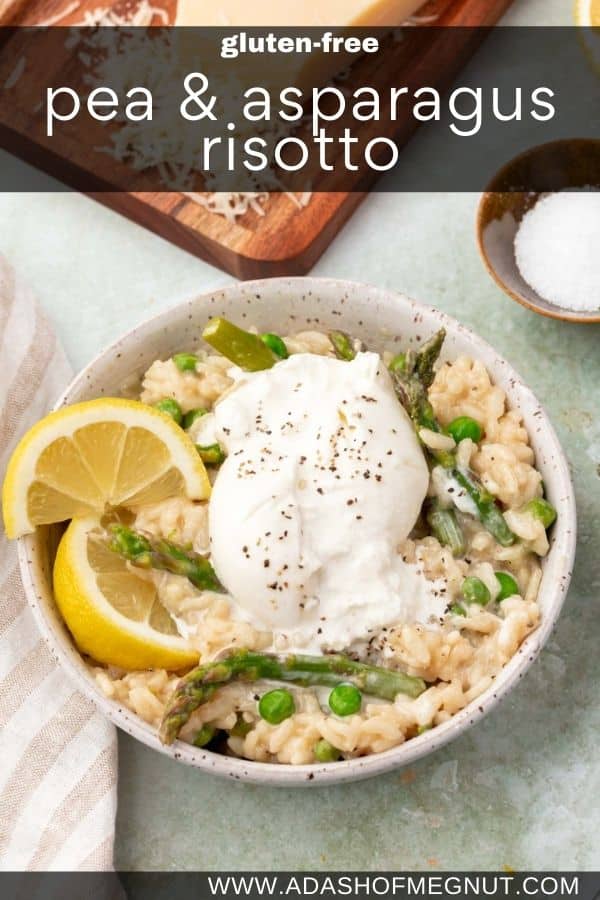A bowl of pea and asparagus risotto topped with two lemon wedges and a ball of burrata that has been broken.
