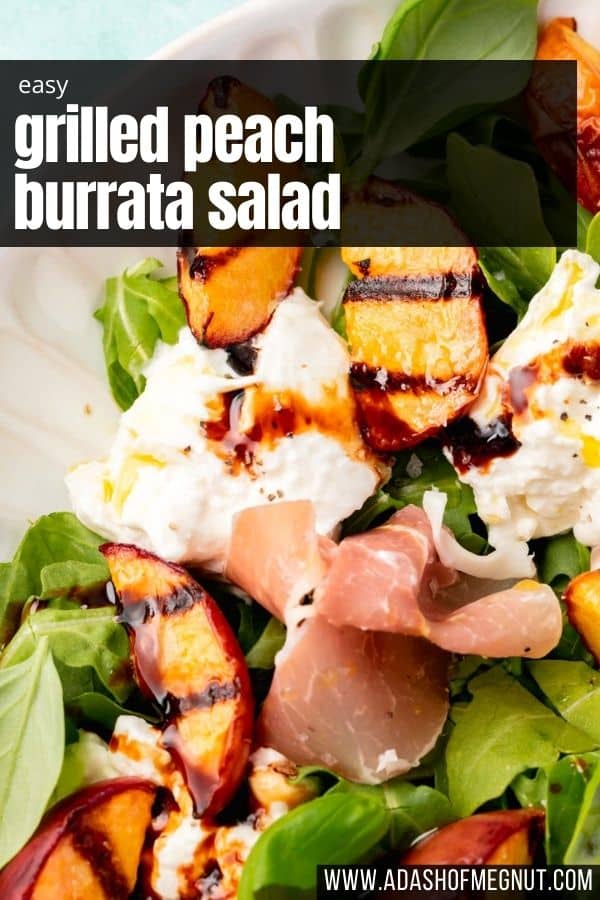 A close up of grilled peach arugula salad with burrata, prosciutto, balsamic glaze and black pepper.
